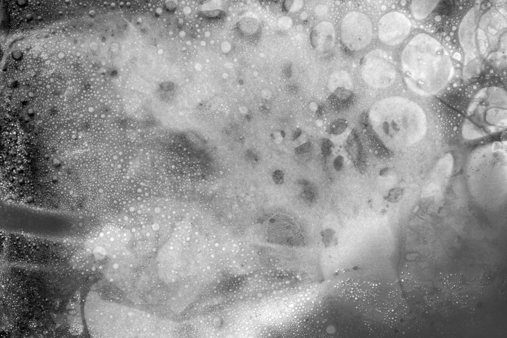 Monochrome contact print of bubbles and foam